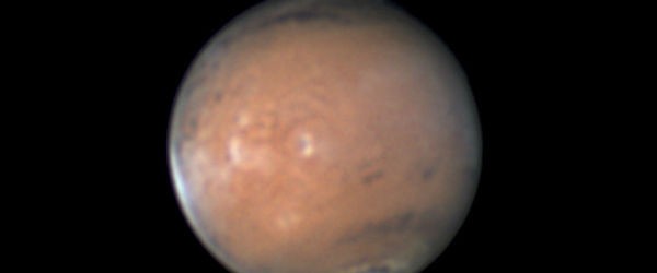 Strange phenomenon spotted over Mars two weeks ago puzzled astronomy community. An unusual protrusion has appeared in the planet’s southern hemisphere, preceding the sunrise terminator. Astrophotographer Wayne Jaeschke reports on his website of a “strange feature” over the Martian plain called Acidalia that moves with the planet and seems to rise over the limb, occurring at 190.5° east, 43.7° south. Some of the observers suggest the feature extend 150 miles up from the surface. Other planetary observers also report capturing the feature as the area rotated into view during the past few nights, and planetary photographers from Europe have identified it in their images as far back as March...