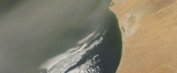 Email Email Dust poured off the coast of Africa and over the Atlantic Ocean on in mid-July, 2012. A broad plume of dust blows to the southeast, crossing both Western Sahara (north) and Mauritania (center). As it passes over the Atlantic Ocean, the plume appears to broaden and thin as it covers the Cape Verde Islands. The air over Senegal, to the south, remains relatively clear. (MODIS) No related posts.