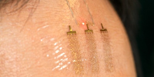 Researchers are now working on wireless flexible electronics as thin as human hair, that can read brain activity. Such devices, they claim, will enable humans to control machines and communicates just by thoughts. By using award-winning technology epidermal electronics, which was in news in 2011 for revolutionizing patient monitoring, scientists have created these 100 micron thick devices – brain machine interfaces – barely visible on skin and hence pretty easy to conceal from others. We have seen patients controlling robotics body parts through brain implants, but that is an invasive technology – suitable for those who need them medically. Epidermal...